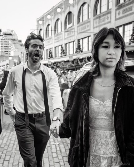 Couple crossing street while holding hands