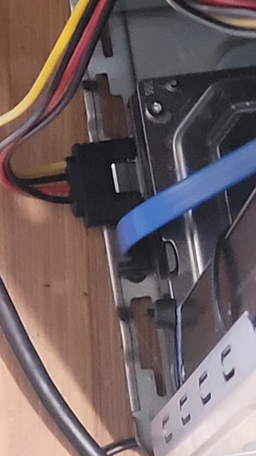 SATA connector that sticks out beyond the edge of a PC cade, making it impossible to close the cover.