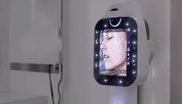 A skin analysis machine shows a close-up of a person's face