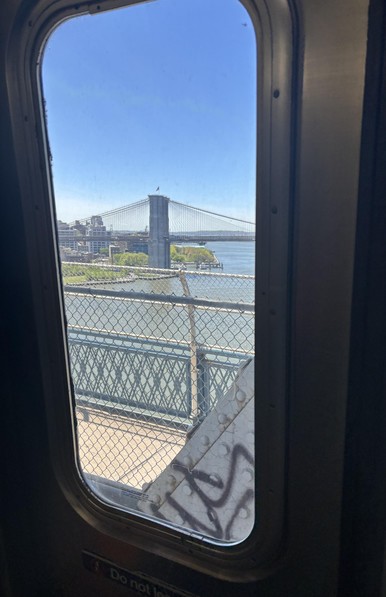NYC Q train, crossing from Manhattan to Brooklyn, a view of another bridge, through a window on my subway.