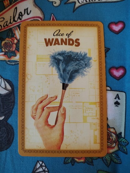 Card from the Housewives Tarot deck.
Ace of Wands.
A hand delicately holds a small feather duster.
