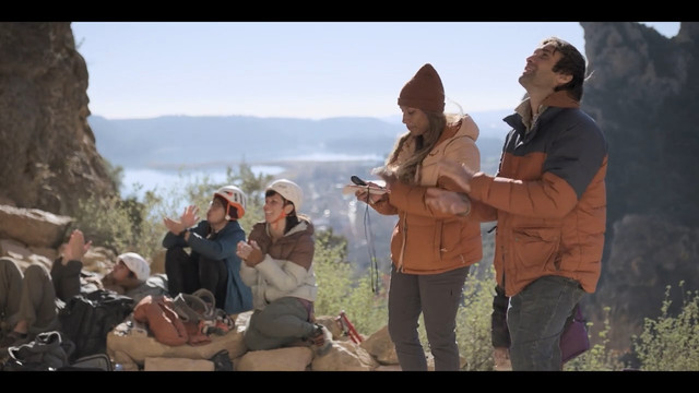 Climbers wearing helmets, except show hosts.