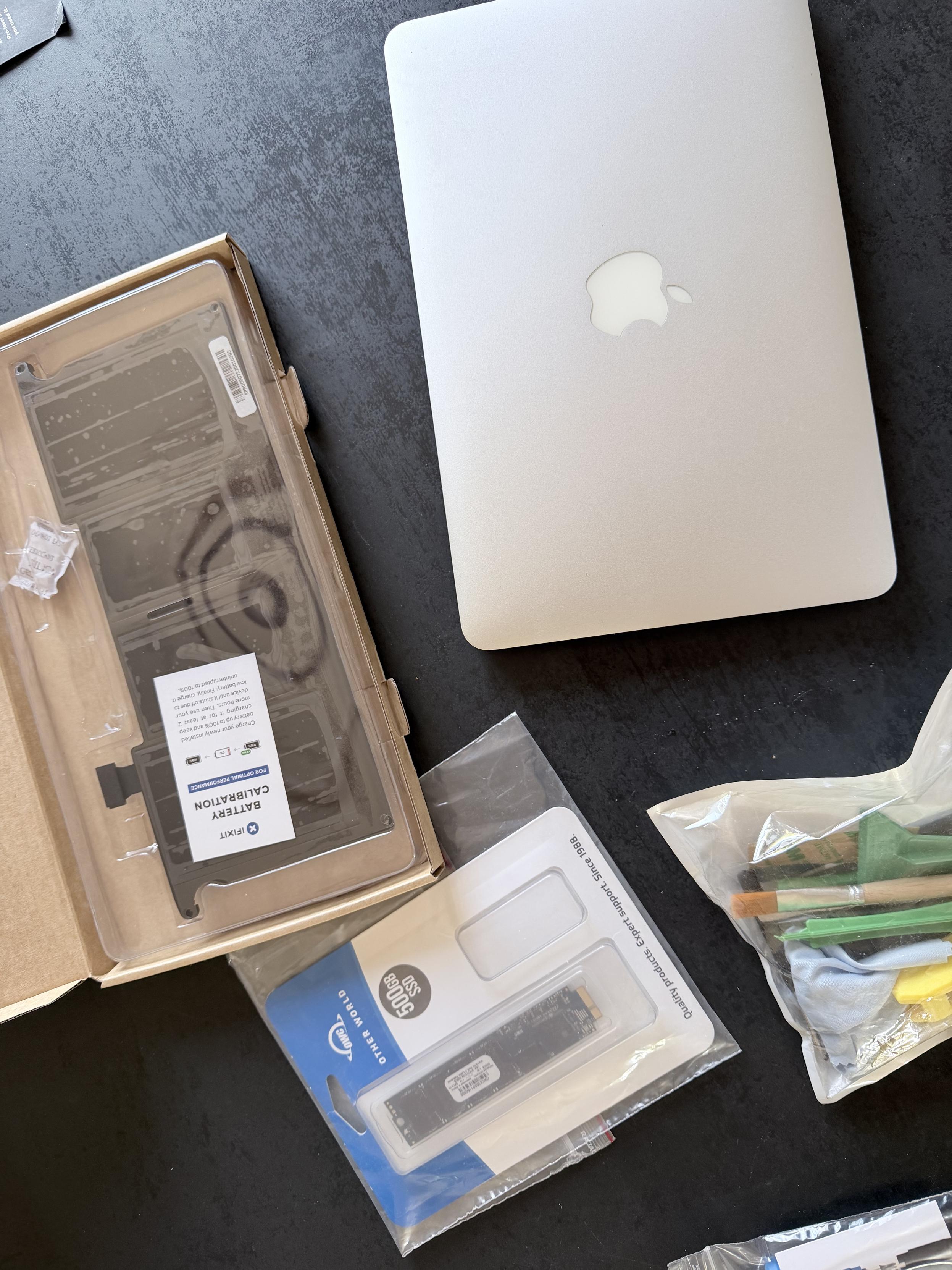 My 11-inch MacBook Air, a new battery, a new SSD, and some tools